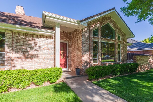 3616 Van Tassel St, Amarillo, TX 79121 - property entrance with brick siding and a chimney
