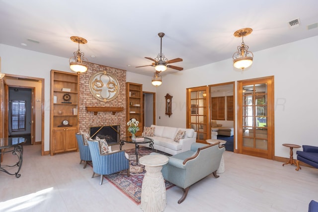 3616 Van Tassel St, Amarillo, TX 79121 - living room with french doors, a brick fireplace, a ceiling fan, and light wood finished floors