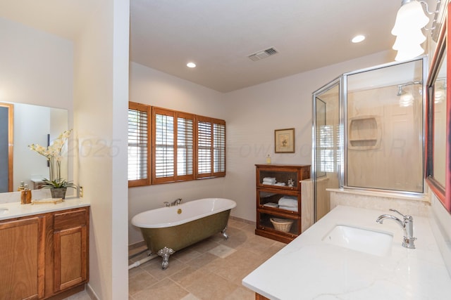 3616 Van Tassel St, Amarillo, TX 79121 - full bathroom featuring a soaking tub, vanity, a shower stall, recessed lighting, and tile patterned floors
