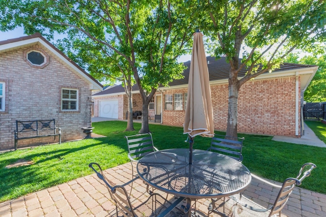 3616 Van Tassel St, Amarillo, TX 79121 - view of patio featuring a garage and outdoor dining area