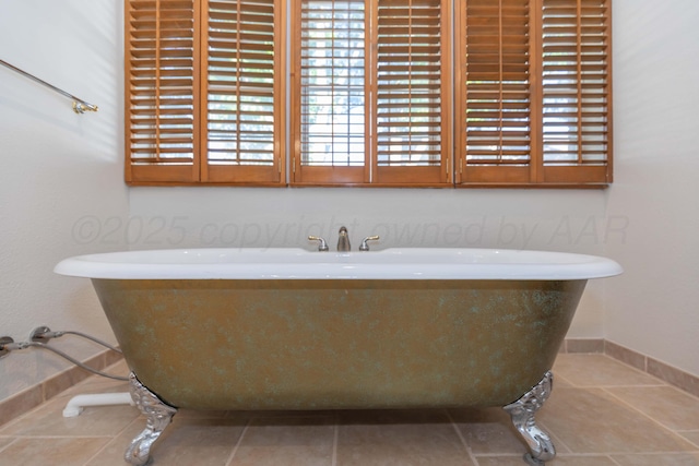 3616 Van Tassel St, Amarillo, TX 79121 - full bathroom with a soaking tub, tile patterned flooring, and baseboards