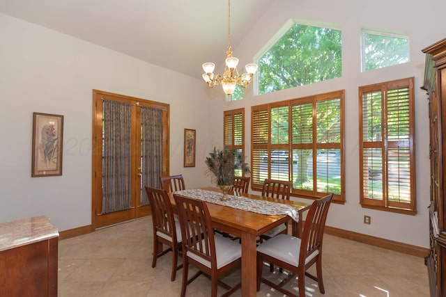 3616 Van Tassel St, Amarillo, TX 79121 - dining space with a chandelier, baseboards, light tile patterned floors, and high vaulted ceiling