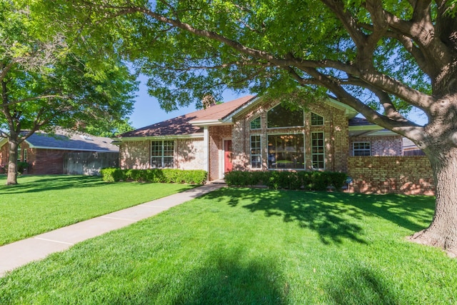3616 Van Tassel St, Amarillo, TX 79121 - single story home featuring brick siding, a front yard, and a chimney