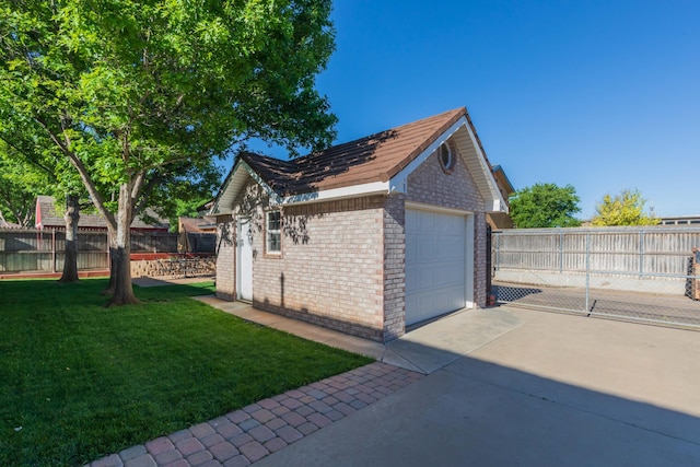 3616 Van Tassel St, Amarillo, TX 79121 - view of side of property with brick siding, an outbuilding, a detached garage, and driveway