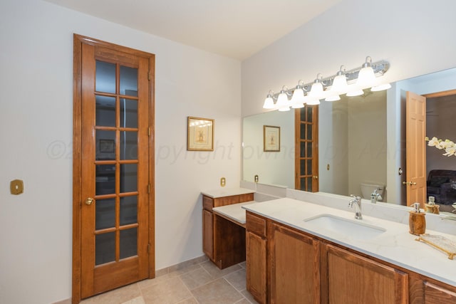 3616 Van Tassel St, Amarillo, TX 79121 - bathroom with toilet, vanity, and baseboards
