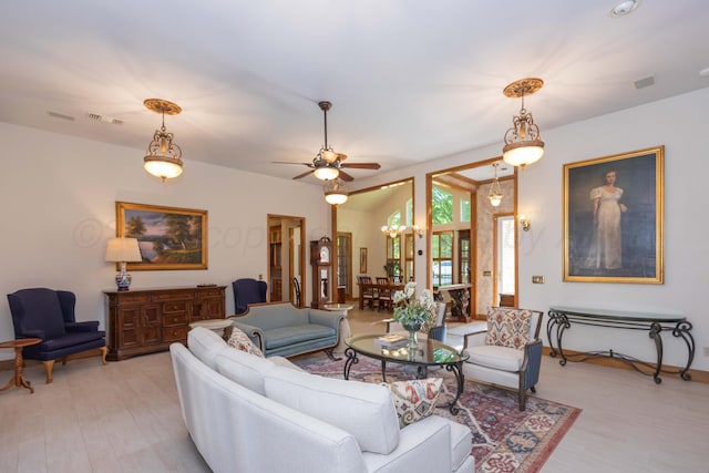 3616 Van Tassel St, Amarillo, TX 79121 - living area with light wood finished floors, a ceiling fan, a chandelier, and baseboards