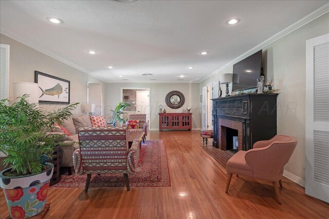 100 S Avondale St, Amarillo, TX 79106 - living room with a fireplace, wood finished floors, crown molding, and recessed lighting