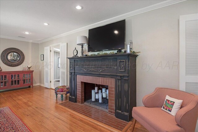 100 S Avondale St, Amarillo, TX 79106 - living area with ornamental molding, a brick fireplace, wood finished floors, and recessed lighting