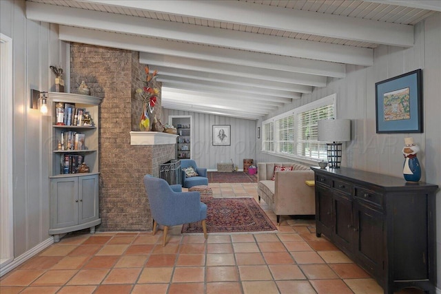 100 S Avondale St, Amarillo, TX 79106 - living room featuring beamed ceiling, a brick fireplace, light tile patterned flooring, and wood walls