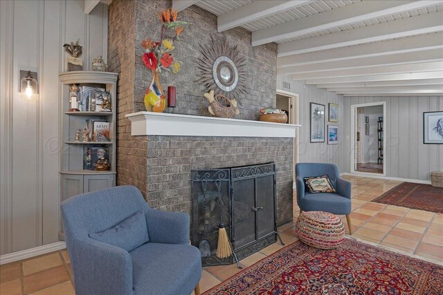 100 S Avondale St, Amarillo, TX 79106 - tiled living area featuring a fireplace, beamed ceiling, and a decorative wall