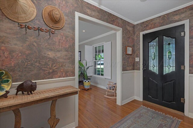 100 S Avondale St, Amarillo, TX 79106 - foyer with ornamental molding, wood finished floors, wainscoting, and wallpapered walls