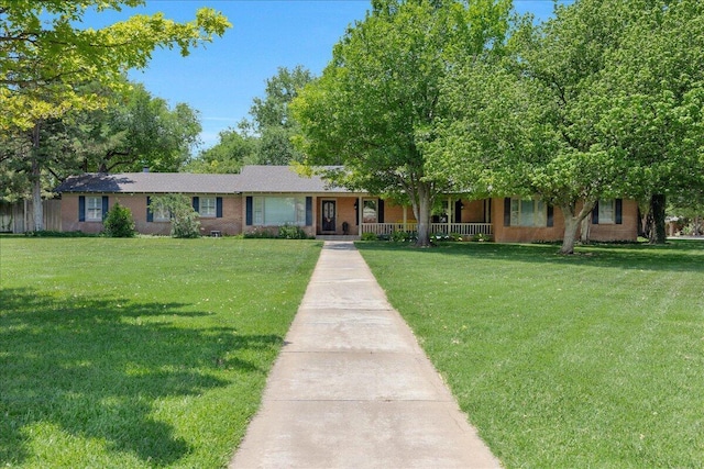 100 S Avondale St, Amarillo, TX 79106 - view of front of property with a porch, brick siding, and a front yard