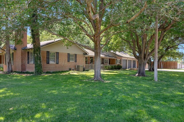 100 S Avondale St, Amarillo, TX 79106 - ranch-style house featuring a garage, brick siding, and a chimney