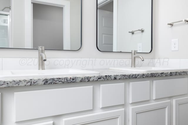 7607 Castleman Rd, Amarillo, TX 79119 - full bathroom featuring double vanity