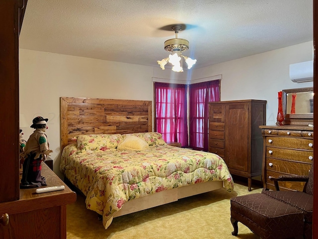 bedroom featuring a wall unit AC, ceiling fan with notable chandelier, a textured ceiling, and carpet floors