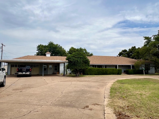 ranch-style home with a front lawn and a carport