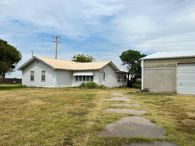 view of side of home with a yard