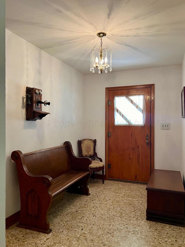 entrance foyer featuring a chandelier