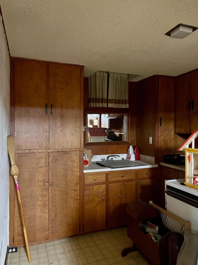 kitchen featuring a textured ceiling