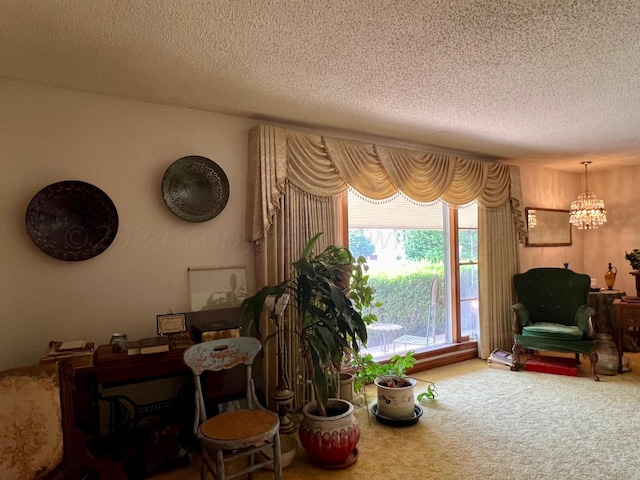 interior space featuring a textured ceiling, carpet floors, and a notable chandelier