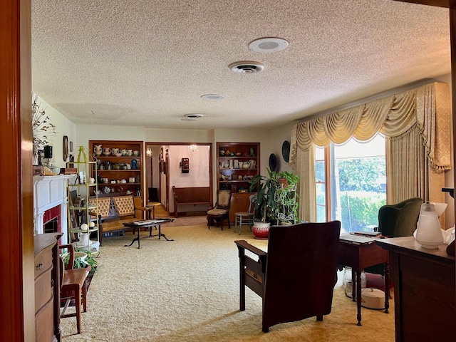 1814 N Main St, Shamrock, TX 79079 - living area featuring a textured ceiling, carpet, and a desk