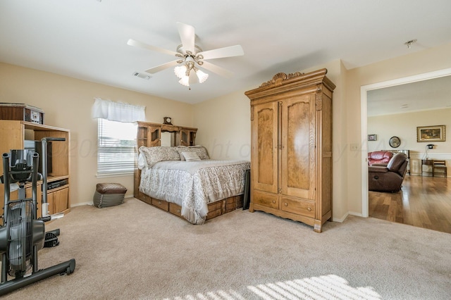 bedroom with ceiling fan and light hardwood / wood-style flooring