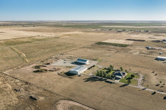 birds eye view of property with a rural view