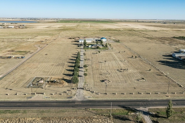 birds eye view of property with a rural view