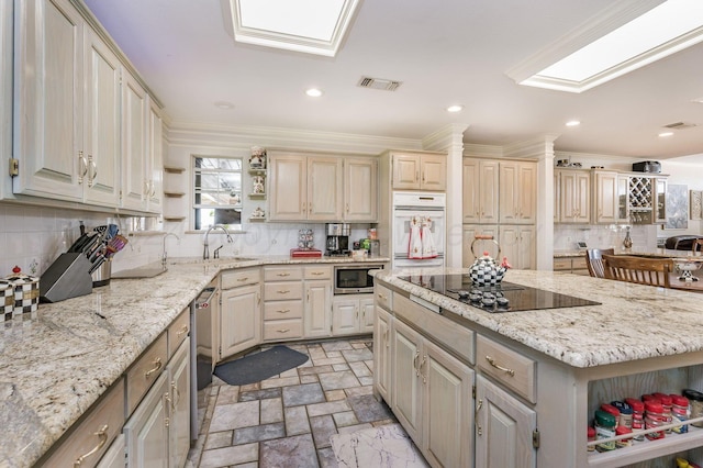 kitchen with tasteful backsplash, light stone countertops, crown molding, and stainless steel appliances