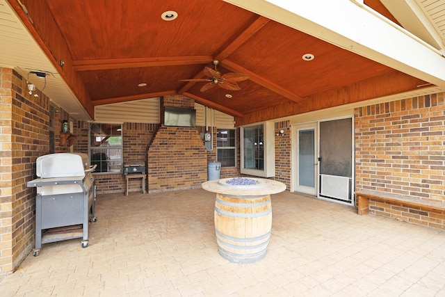 view of patio / terrace featuring ceiling fan, a fire pit, and a grill