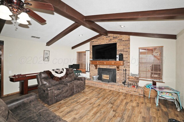 1005 Bennett Dr, Dumas, TX 79029 - living area featuring wood finished floors, ceiling fan, and baseboards