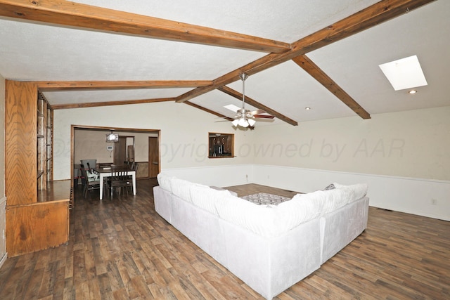 1005 Bennett Dr, Dumas, TX 79029 - living room featuring wood finished floors, a skylight, and a ceiling fan