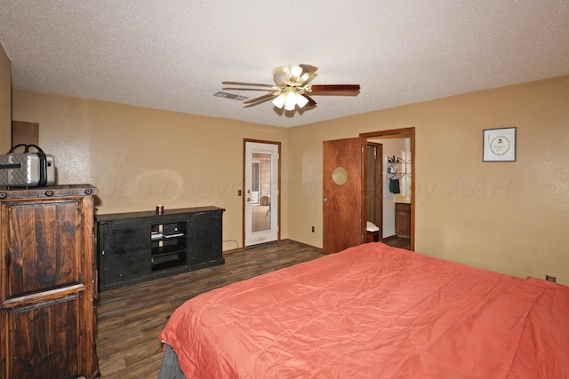 bedroom featuring a ceiling fan, visible vents, ensuite bathroom, and dark wood-type flooring