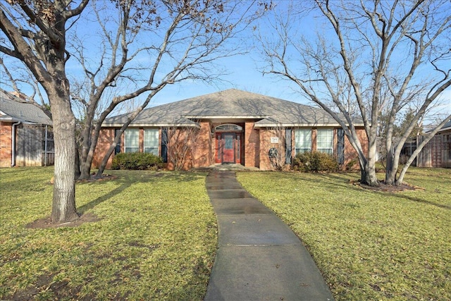 single story home featuring a front yard