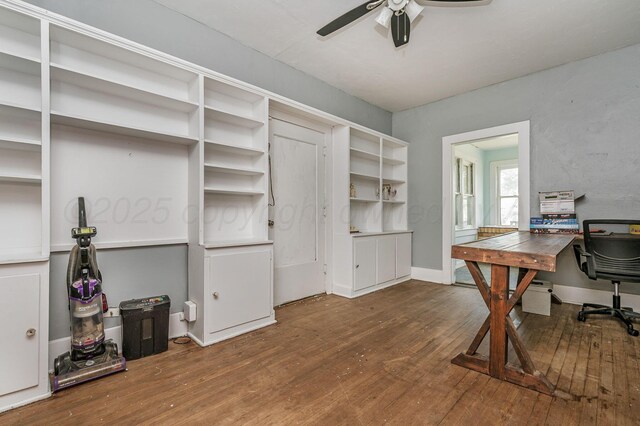 300 E 4th St, Clarendon, TX 79226 - home office featuring wood-type flooring, a ceiling fan, and baseboards