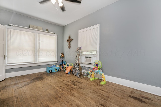 300 E 4th St, Clarendon, TX 79226 - game room with a ceiling fan, cooling unit, wood finished floors, and baseboards