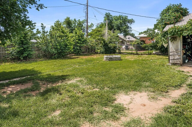 300 E 4th St, Clarendon, TX 79226 - view of yard featuring an outdoor fire pit