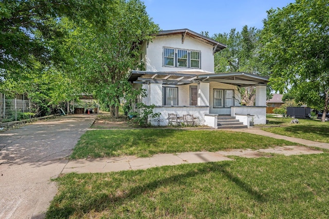 300 E 4th St, Clarendon, TX 79226 - view of front facade featuring covered porch, stucco siding, a front lawn, and driveway
