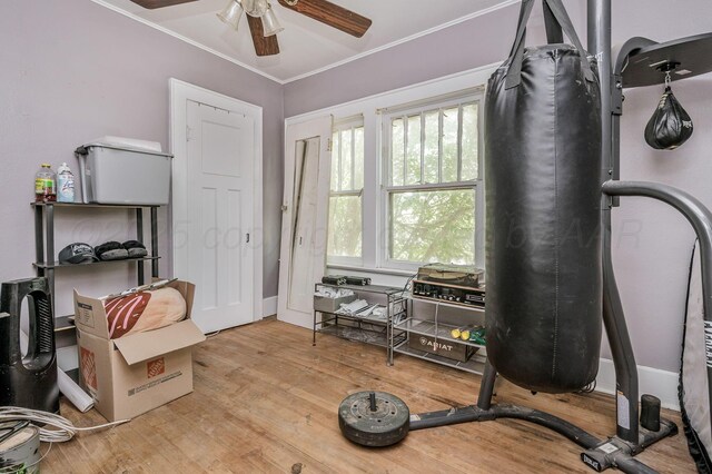 300 E 4th St, Clarendon, TX 79226 - exercise area featuring a ceiling fan, wood finished floors, and ornamental molding