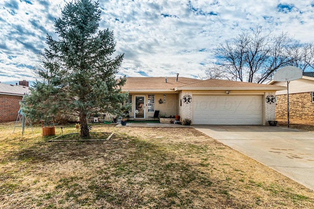 ranch-style home with a garage, concrete driveway, brick siding, and a front lawn