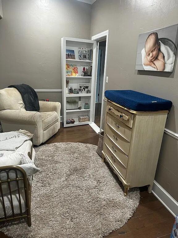 sitting room with dark hardwood / wood-style flooring