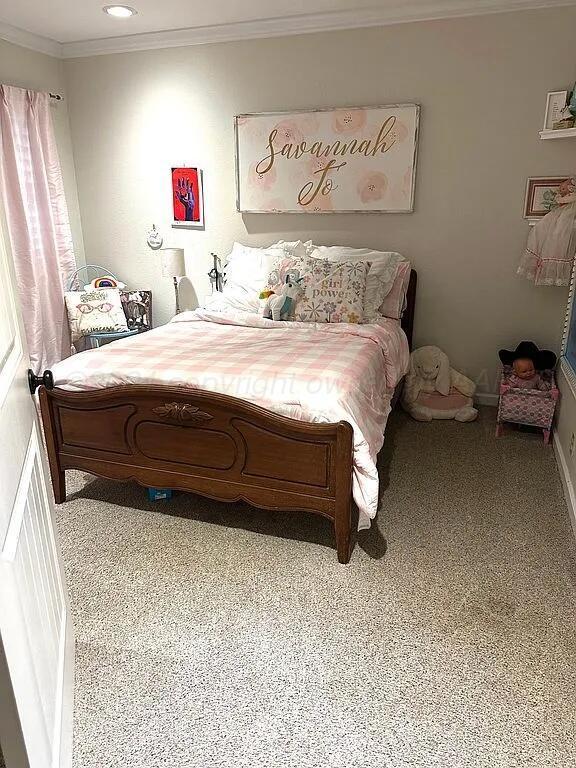 bedroom featuring carpet flooring and ornamental molding