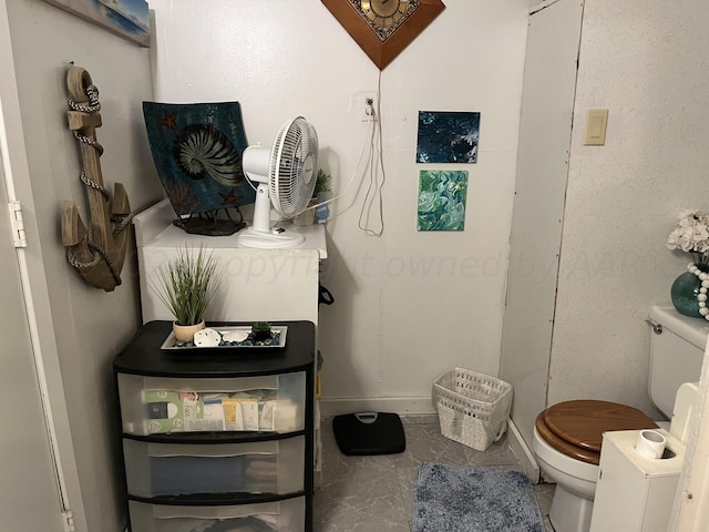 bathroom with tile patterned floors and toilet