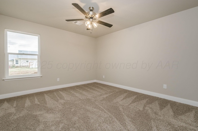 carpeted spare room with ceiling fan