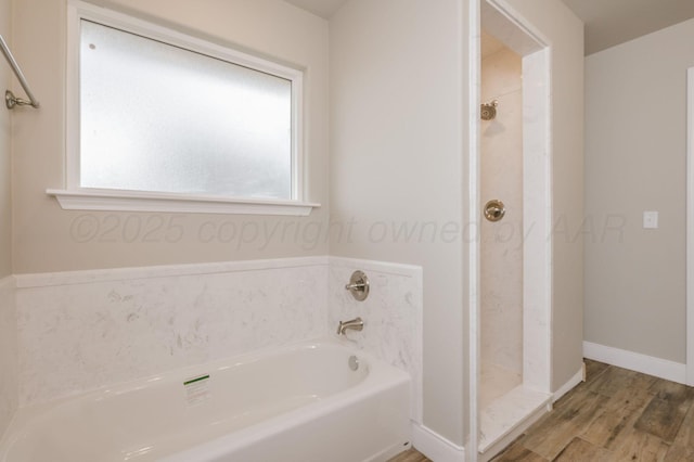 bathroom featuring hardwood / wood-style floors and independent shower and bath