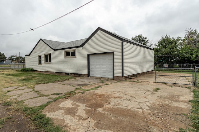 garage featuring a yard