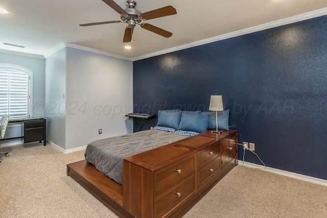 carpeted bedroom with ceiling fan and ornamental molding