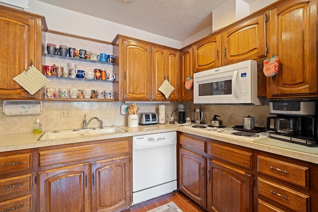 3100 Pittsburg St, Amarillo, TX 79103 - kitchen featuring white appliances, a sink, tasteful backsplash, and light countertops
