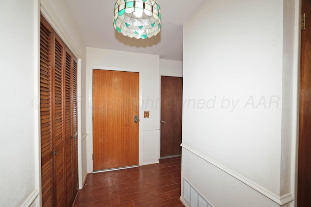 corridor featuring wood finished floors