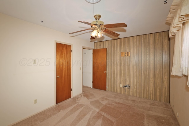 spare room with carpet flooring and ceiling fan